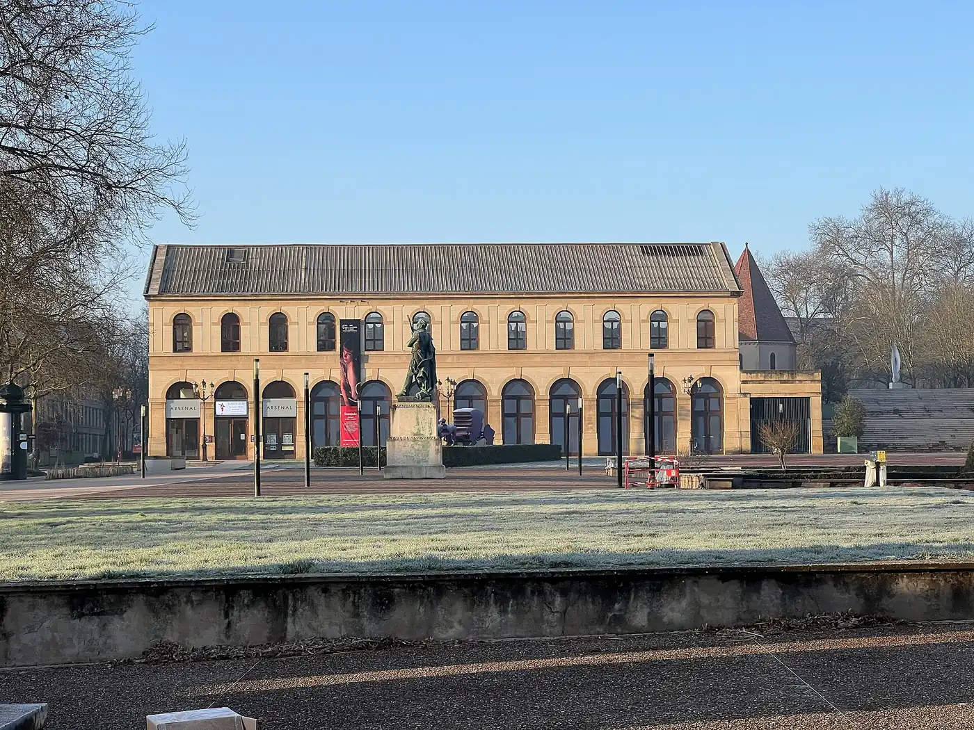 The sandstone facade of the Arsenal across a lawn