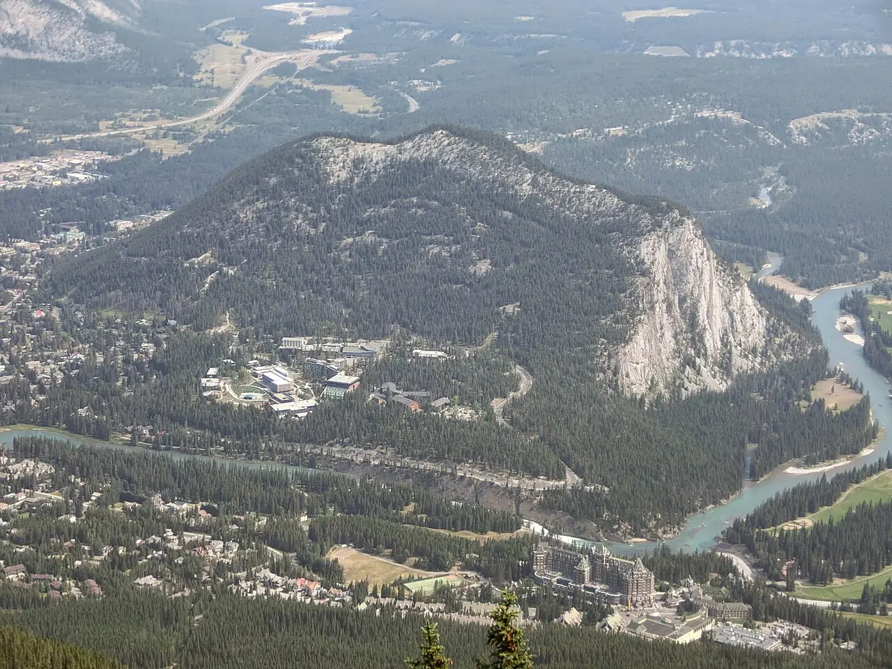 A mountain rising above a river valley