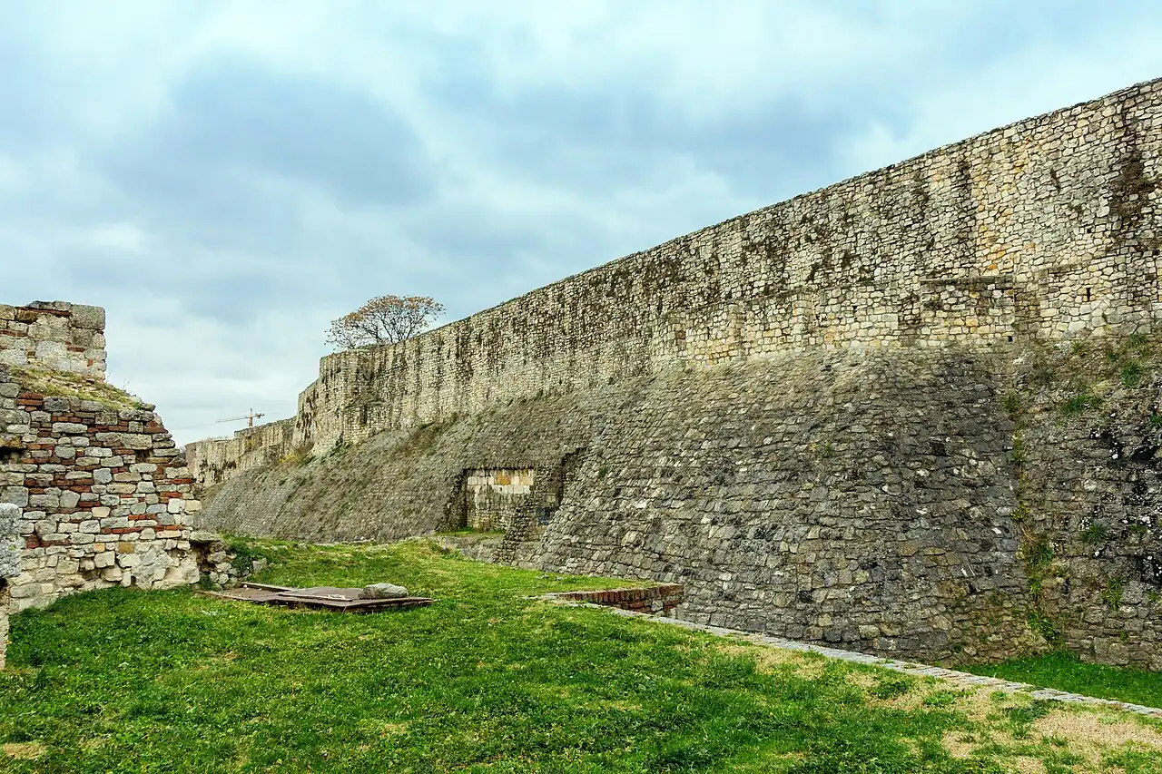 A long grassy rampart and stone wall of Belgrade Fortress