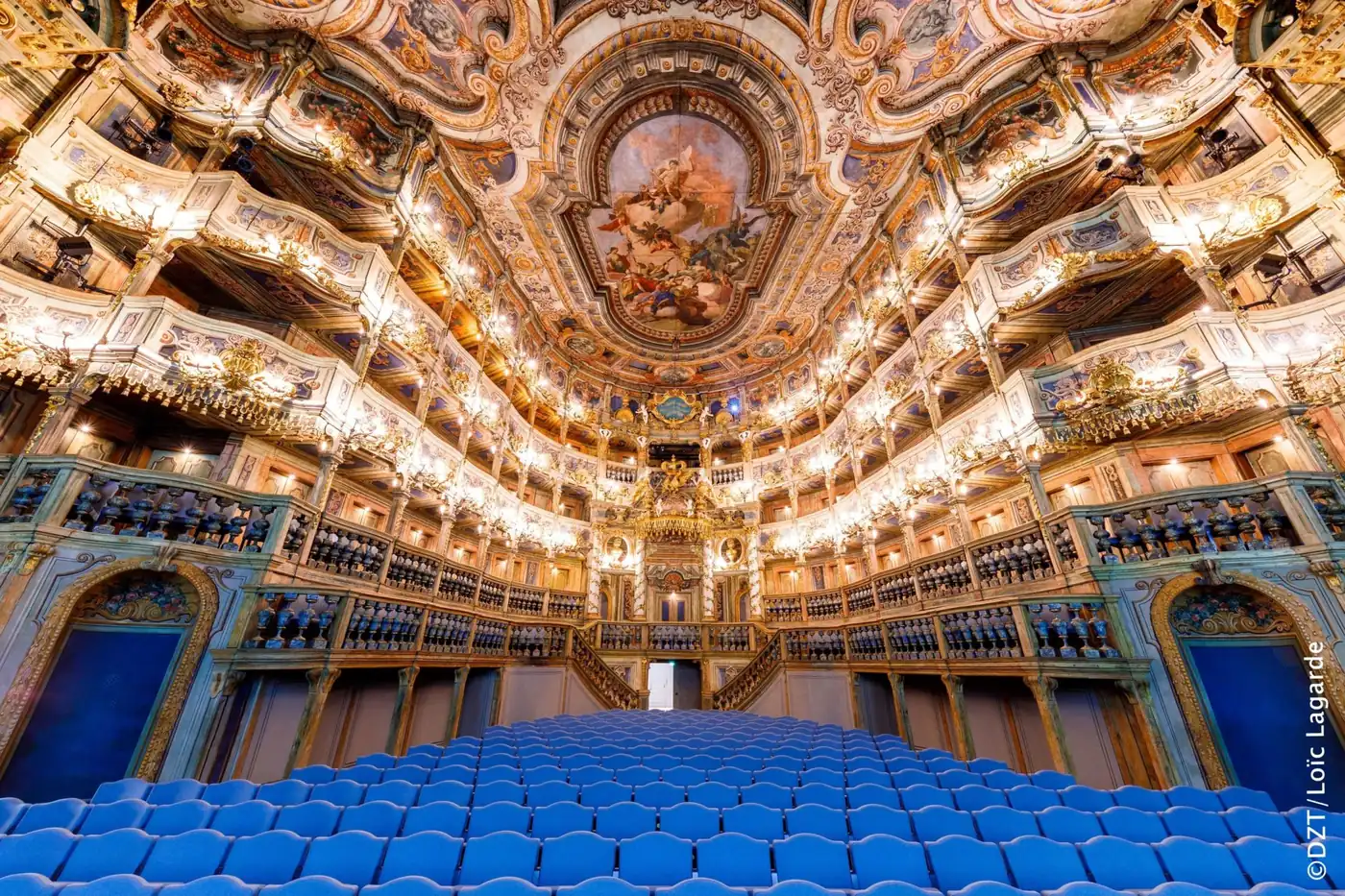 The gilded tiers and painted ceiling of the Margravial Opera House in Bayreuth