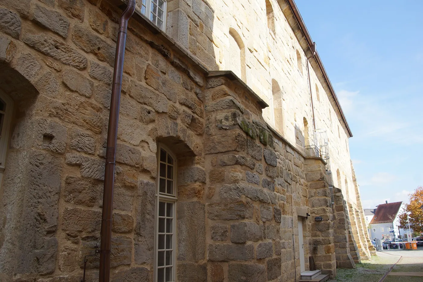 The weathered stone side of the opera house