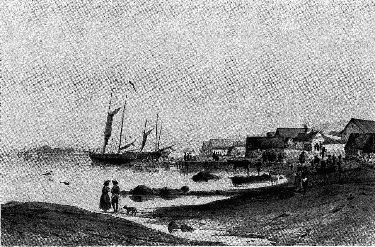 A historic black-and-white view of ships in a harbour