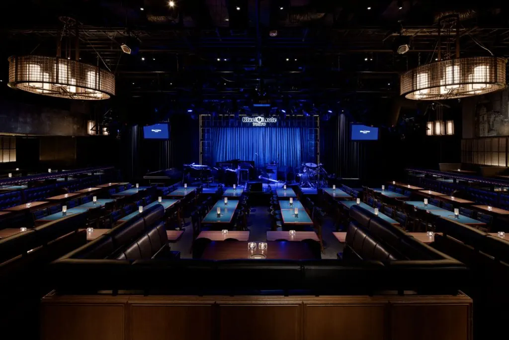 The dark stage and empty tables of the club
