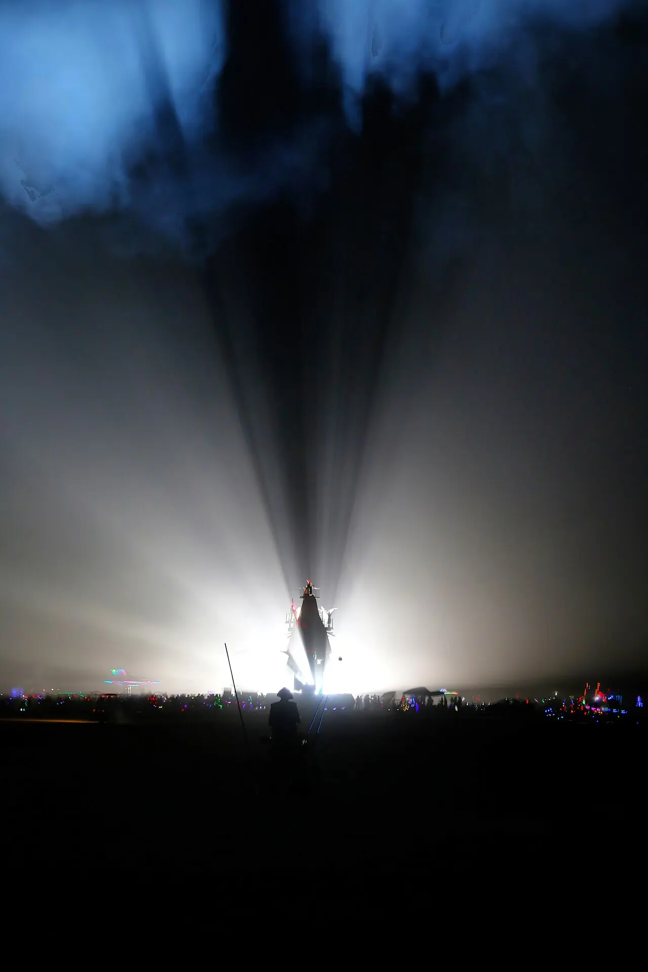 A beam of white light in a dark sky