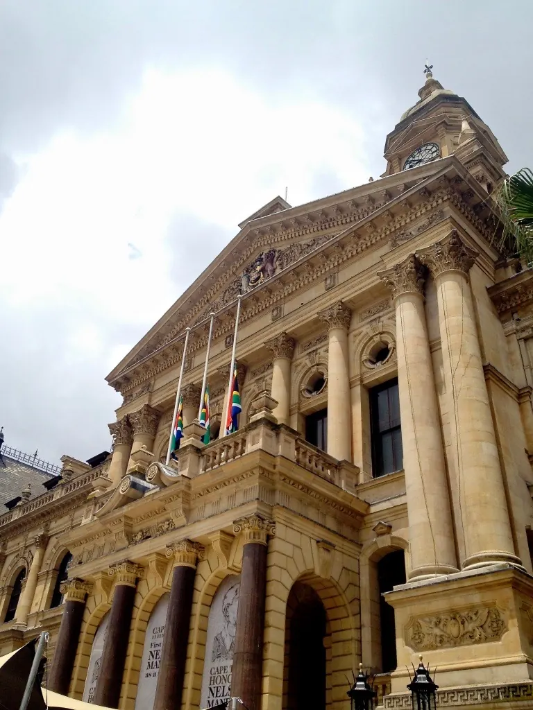 A corner of City Hall's tower and ornate stonework