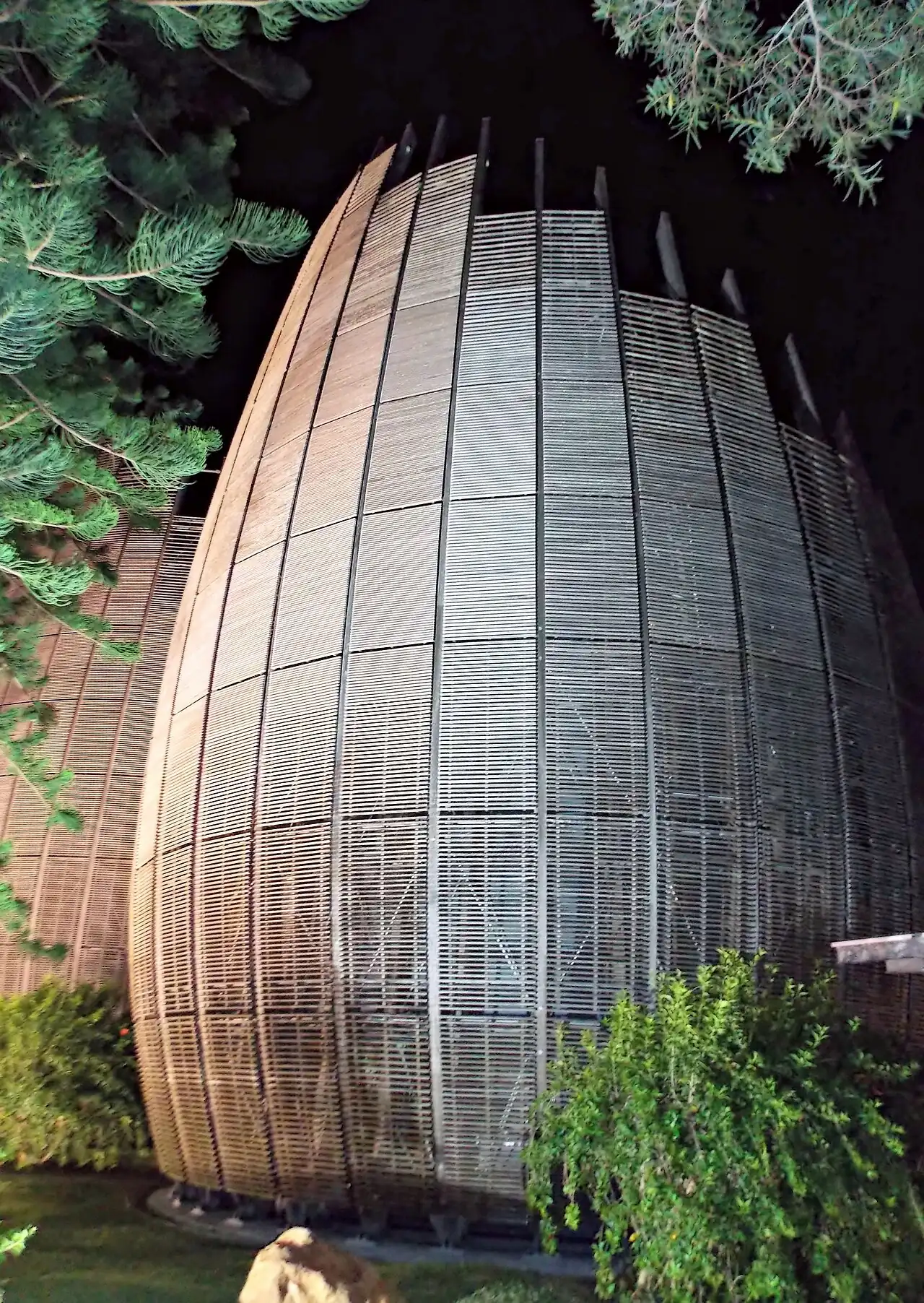 One of the tall curved timber huts of the cultural centre