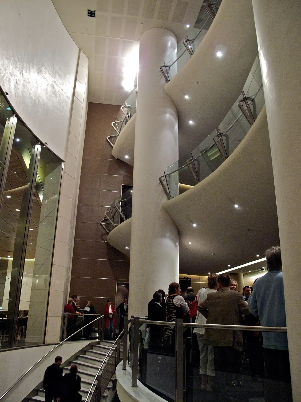A curved staircase in the hall's foyer