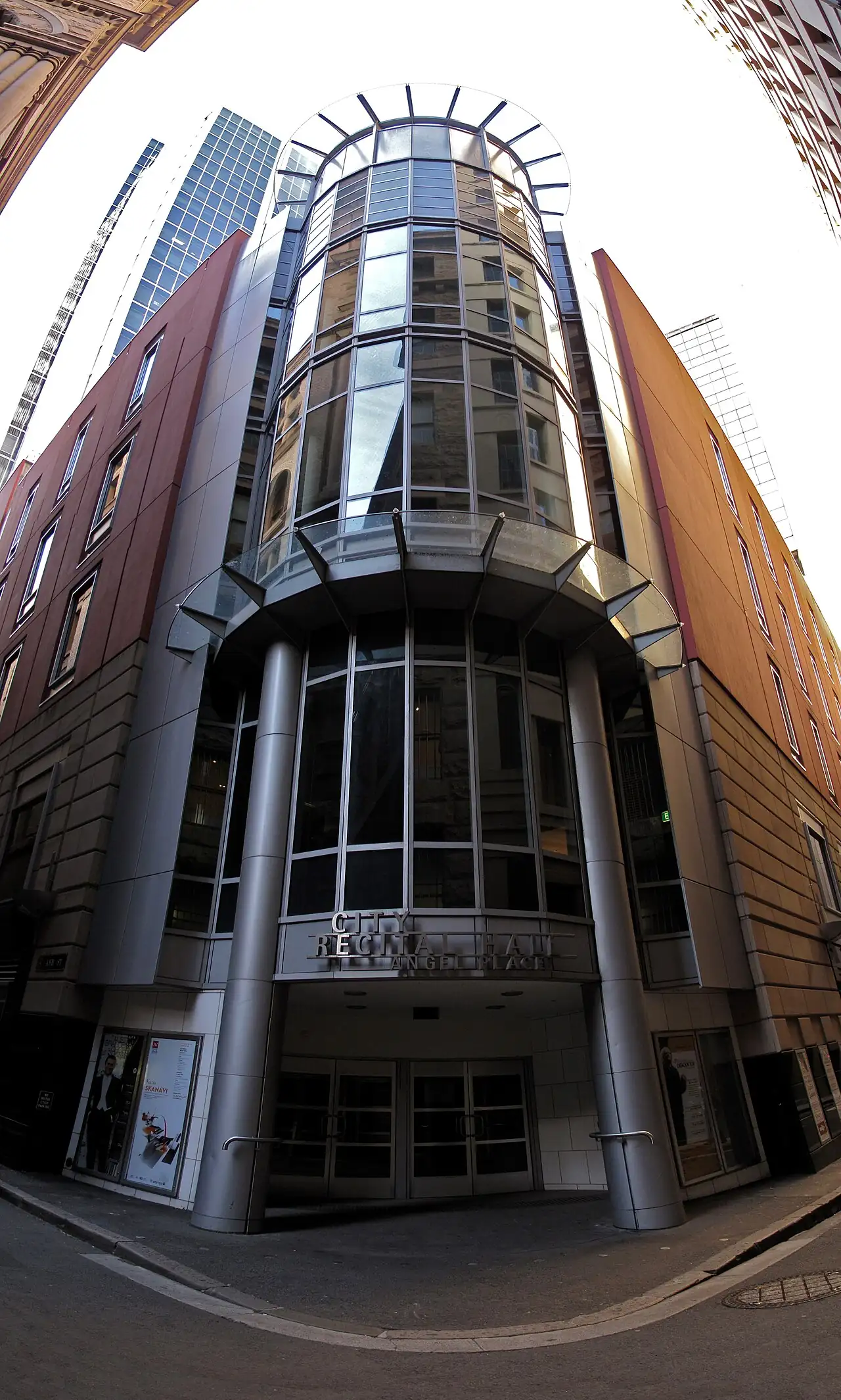 A brick and glass tower seen from below in Angel Place, Sydney