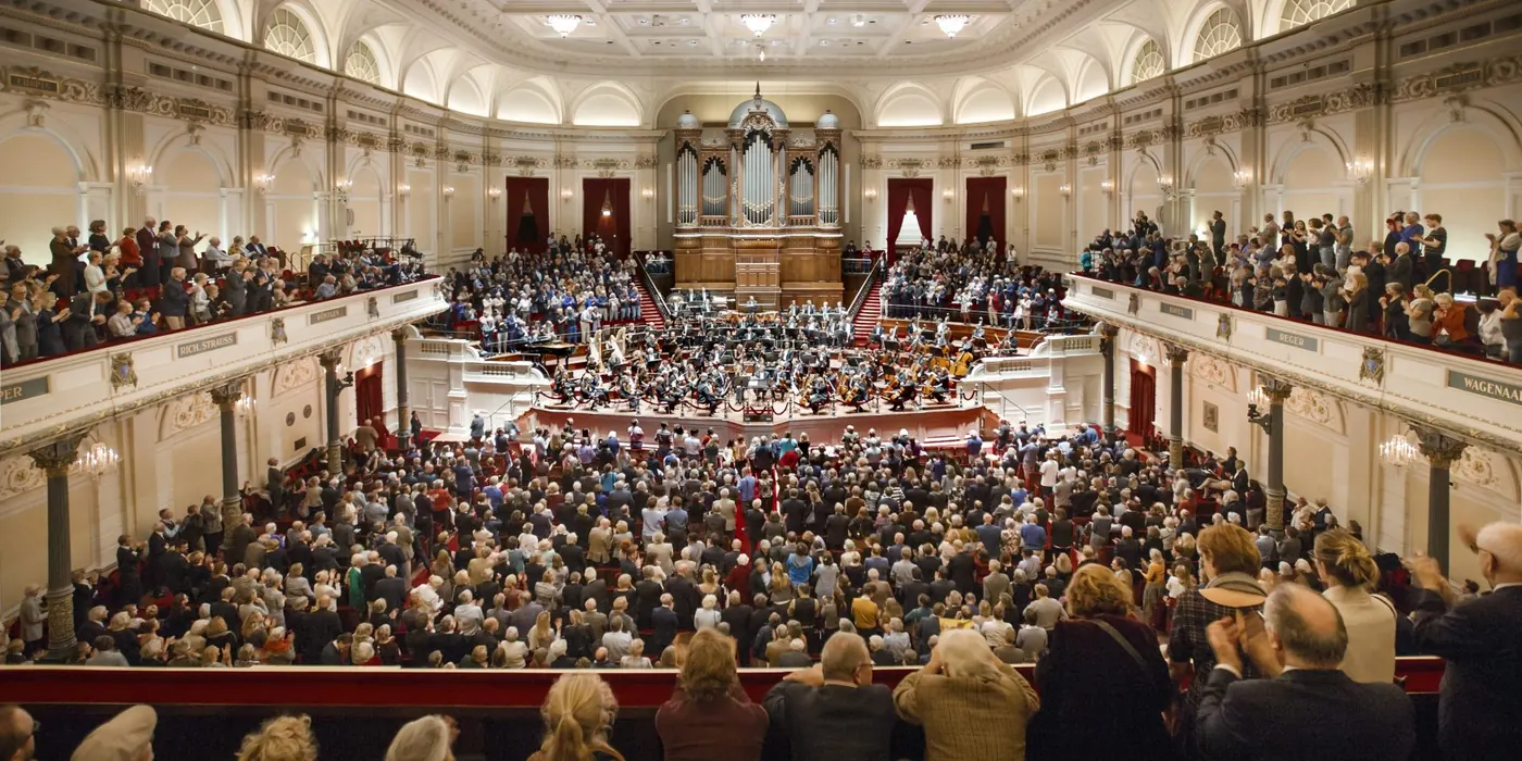 Musicians on stage and a full audience in the Main Hall of the Concertgebouw, Amsterdam