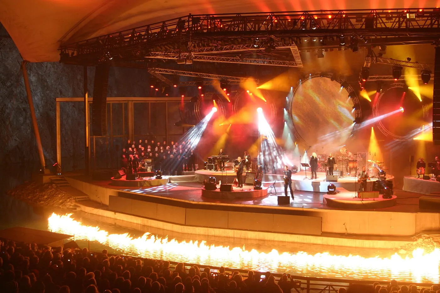 A concert on the stage lit orange