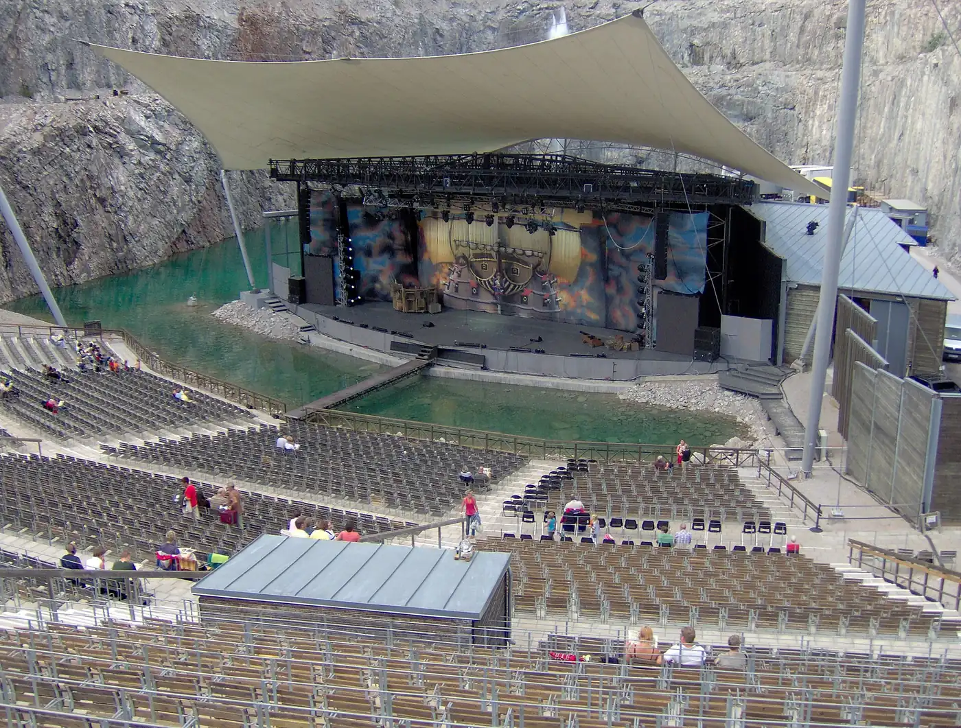 The tiered seating and stage roof in the quarry