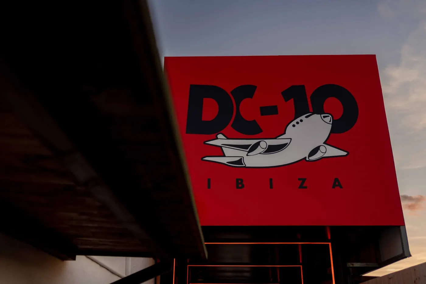 The red DC-10 sign on the club wall