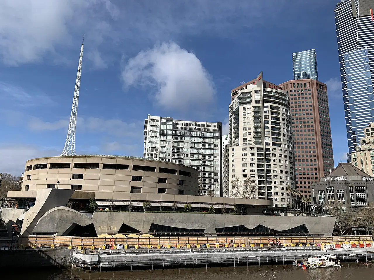 The hall's riverside terrace with skyscrapers behind