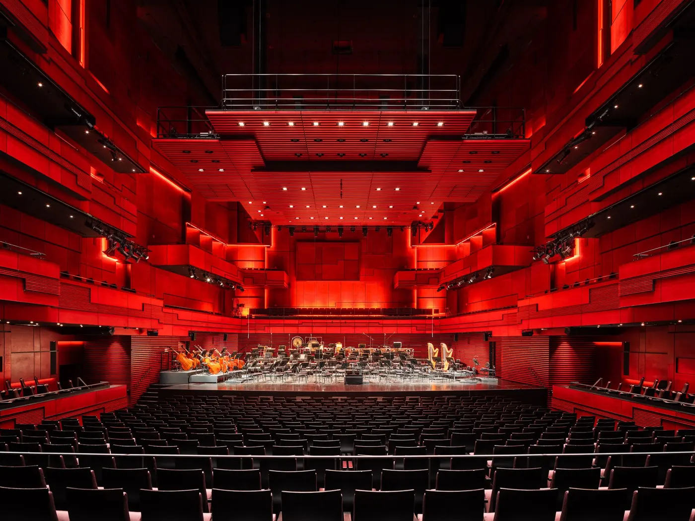 The red interior of Eldborg concert hall, looking down the hall
