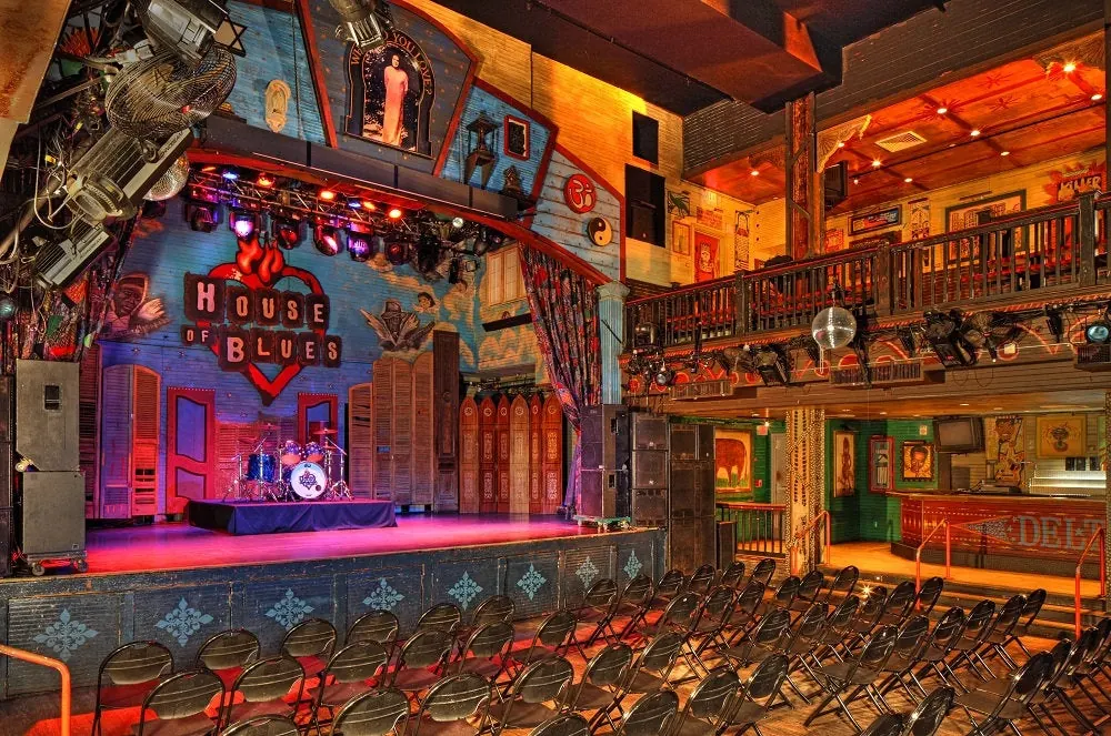 The lit stage and wooden floor of the House of Blues