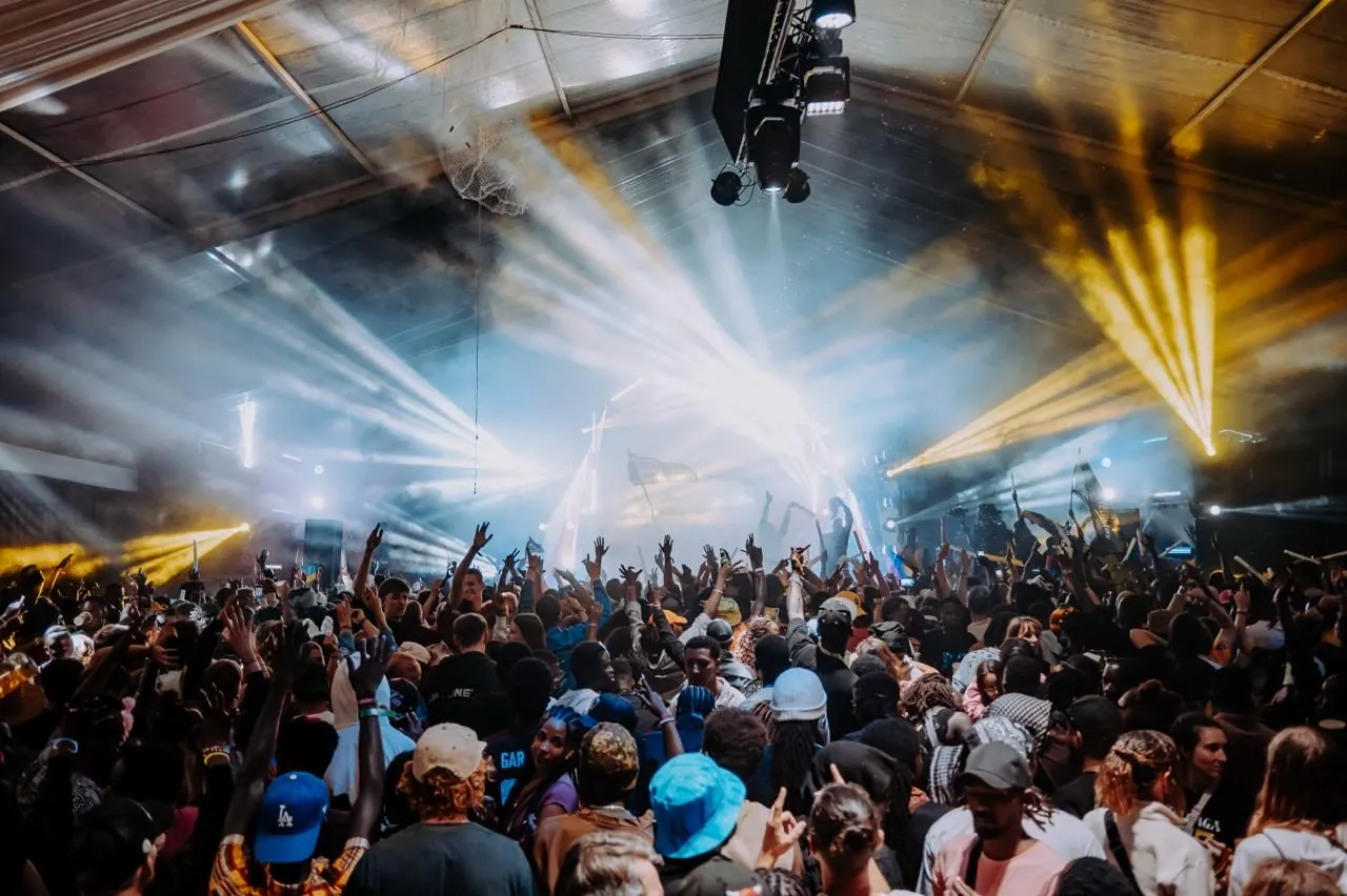 Stage lasers and lights over a crowd