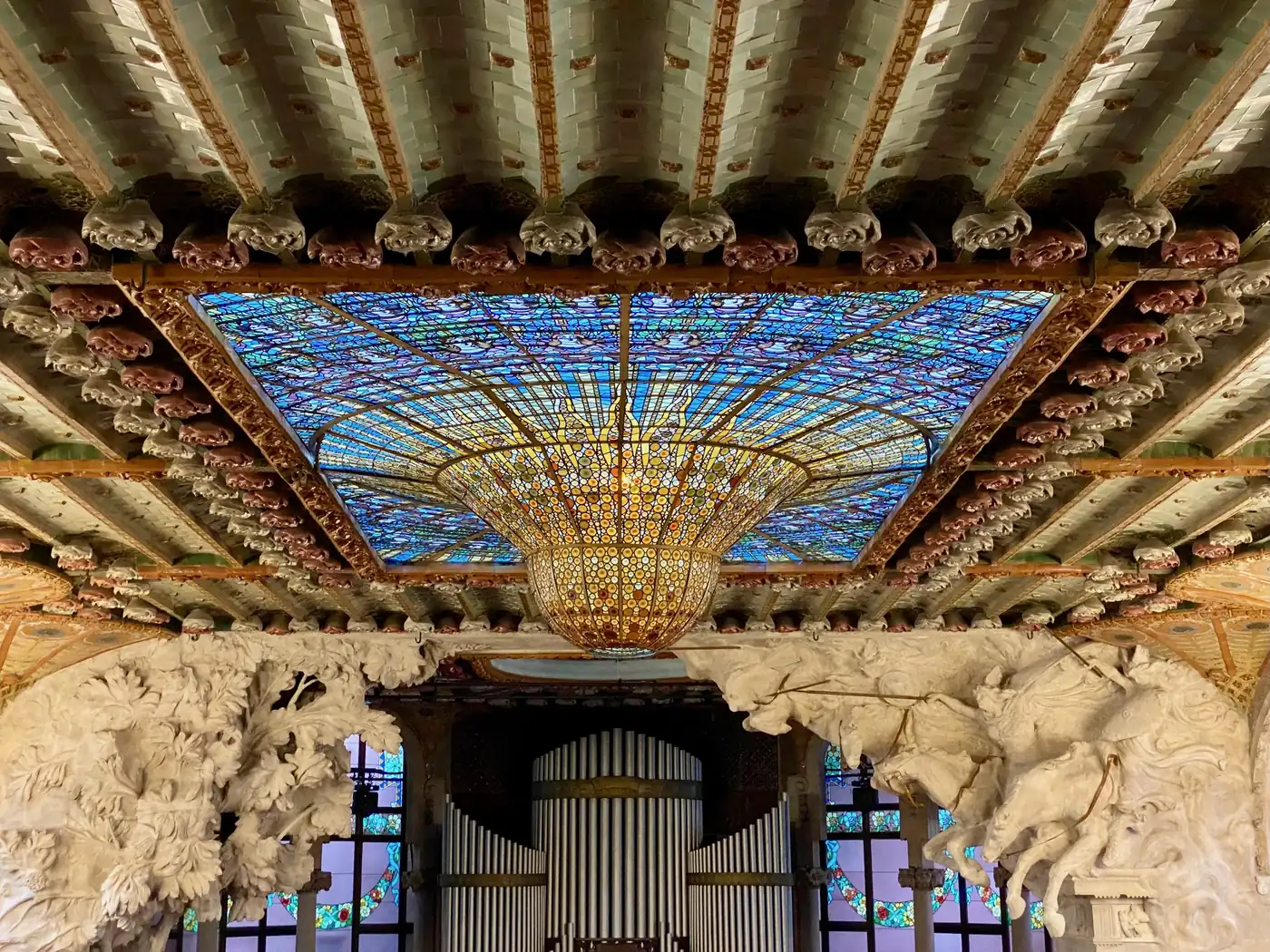 The inverted stained-glass dome above the stage