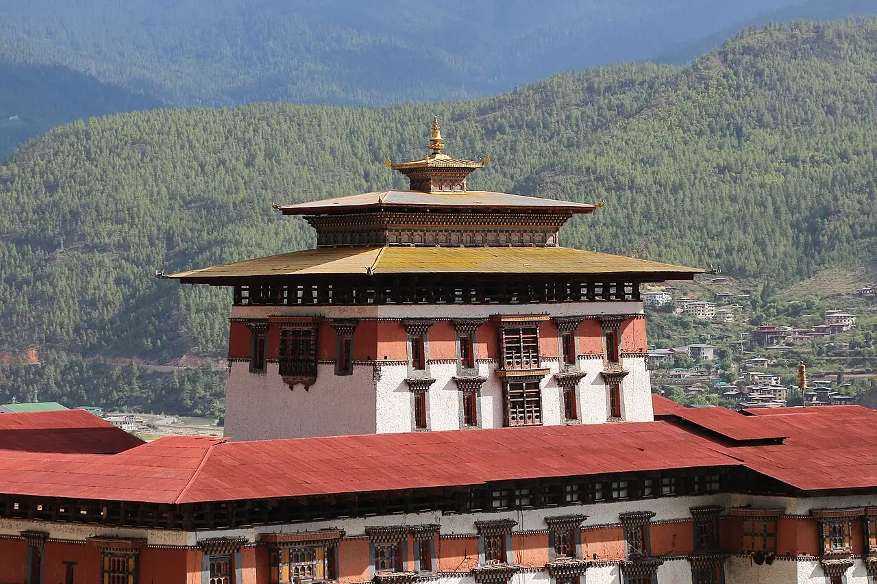 The red-banded upper walls of a Bhutanese dzong from above