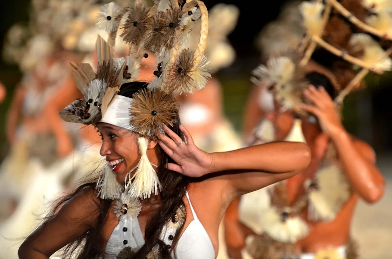 A dancer in a feathered headdress