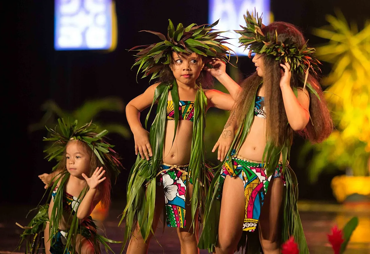 Children in green leaf costumes