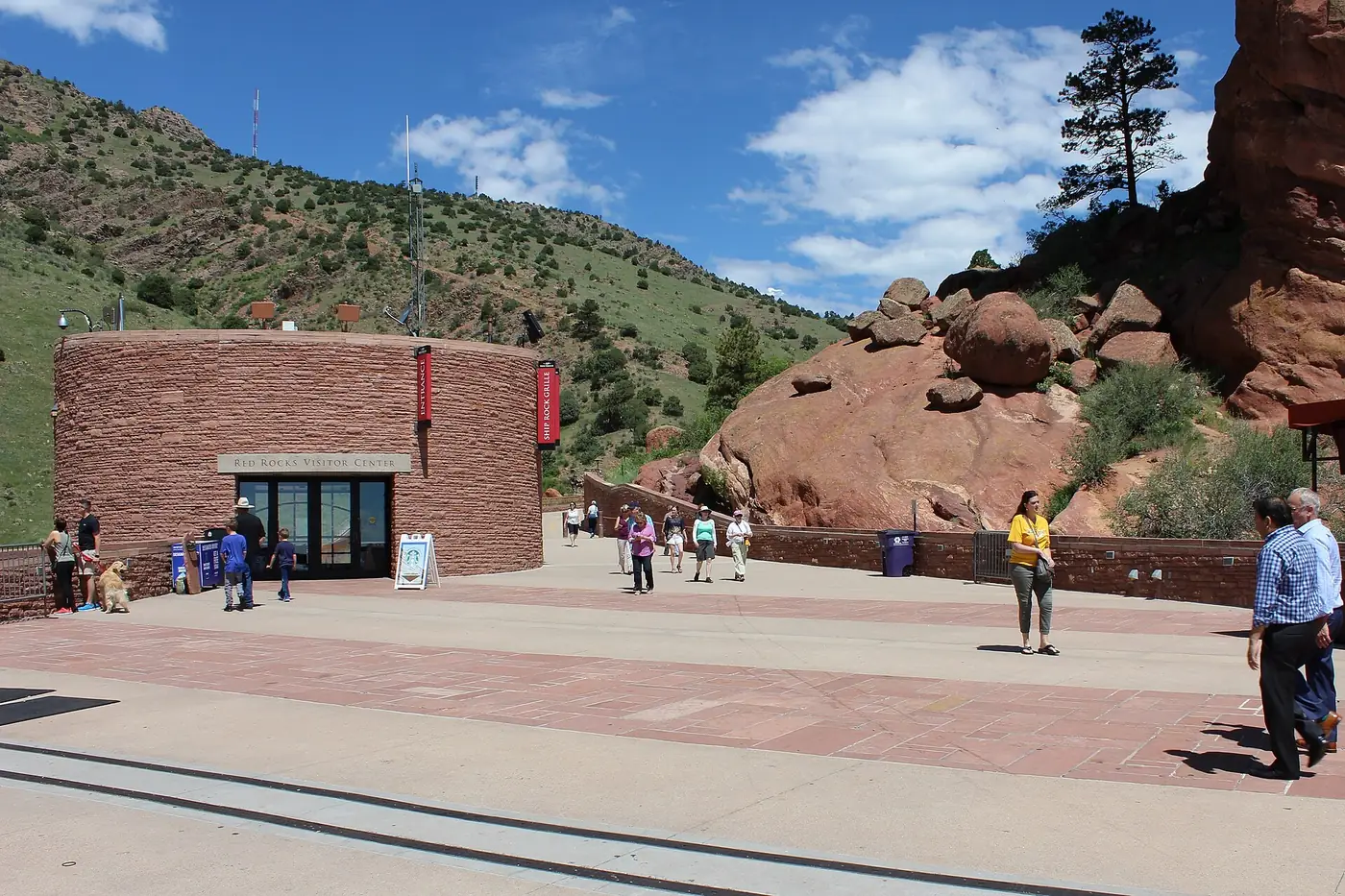 The stage building and red rocks under a blue sky
