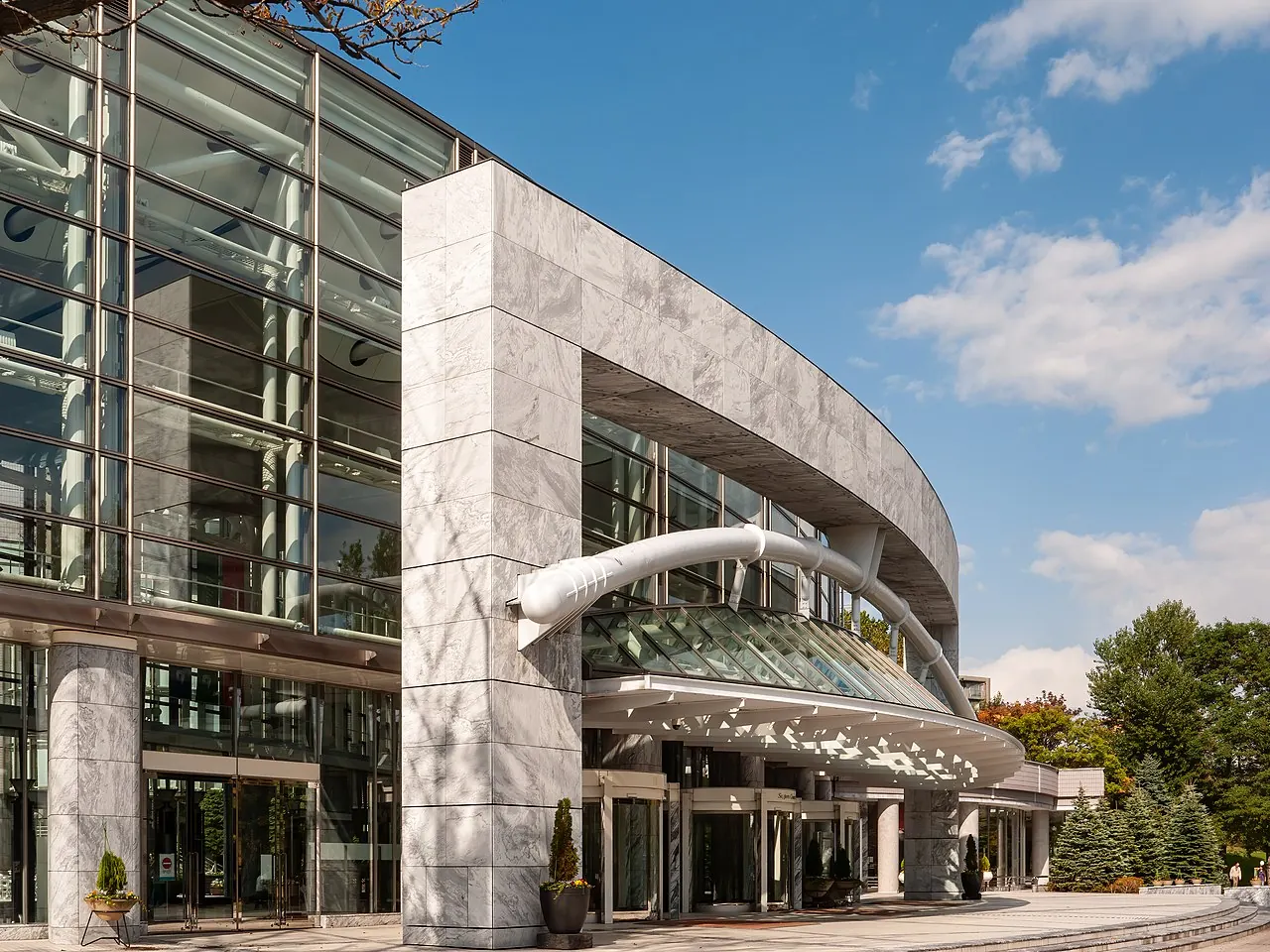 The glass and stone facade of the concert hall