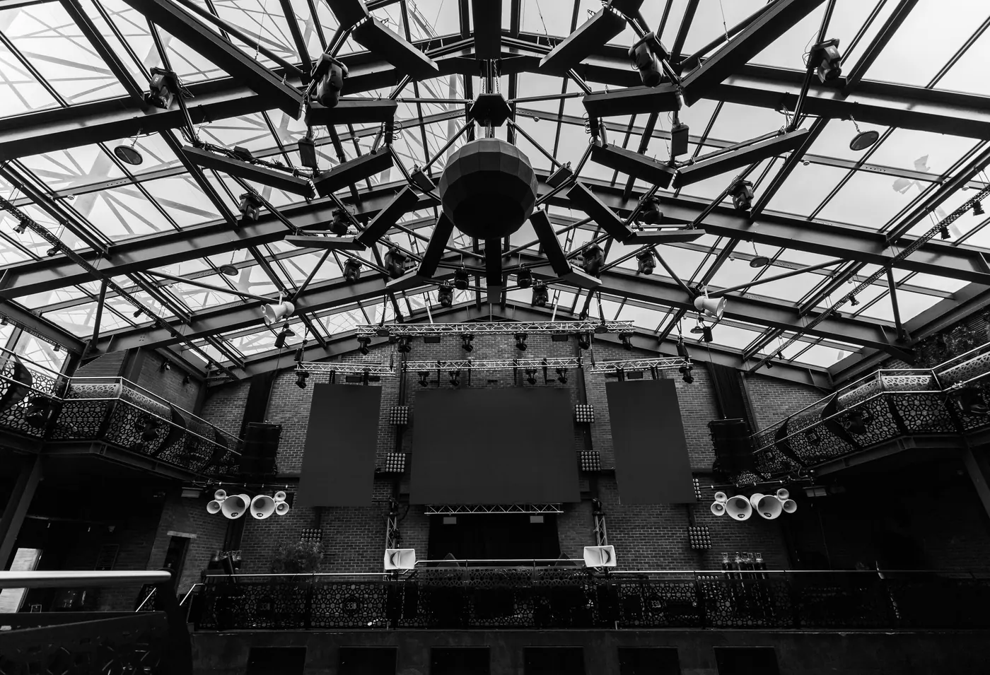 The empty steel-framed hall of Studio 338 in black and white