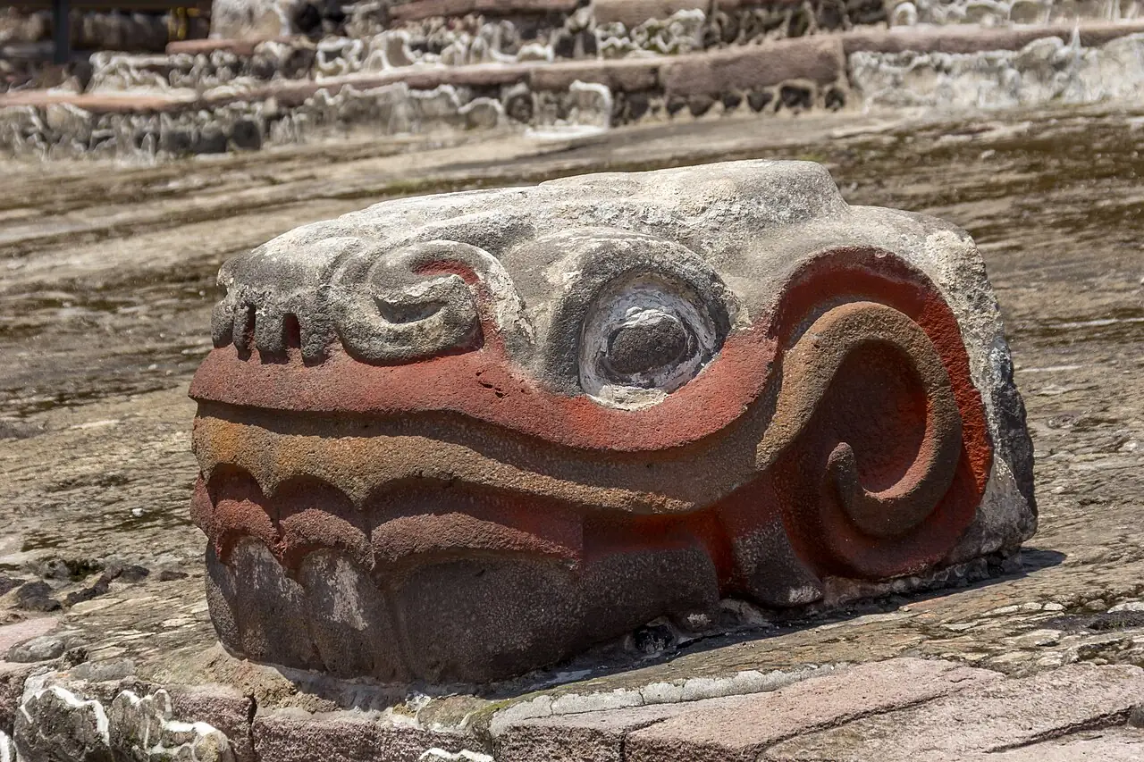 A carved stone serpent head at the Templo Mayor