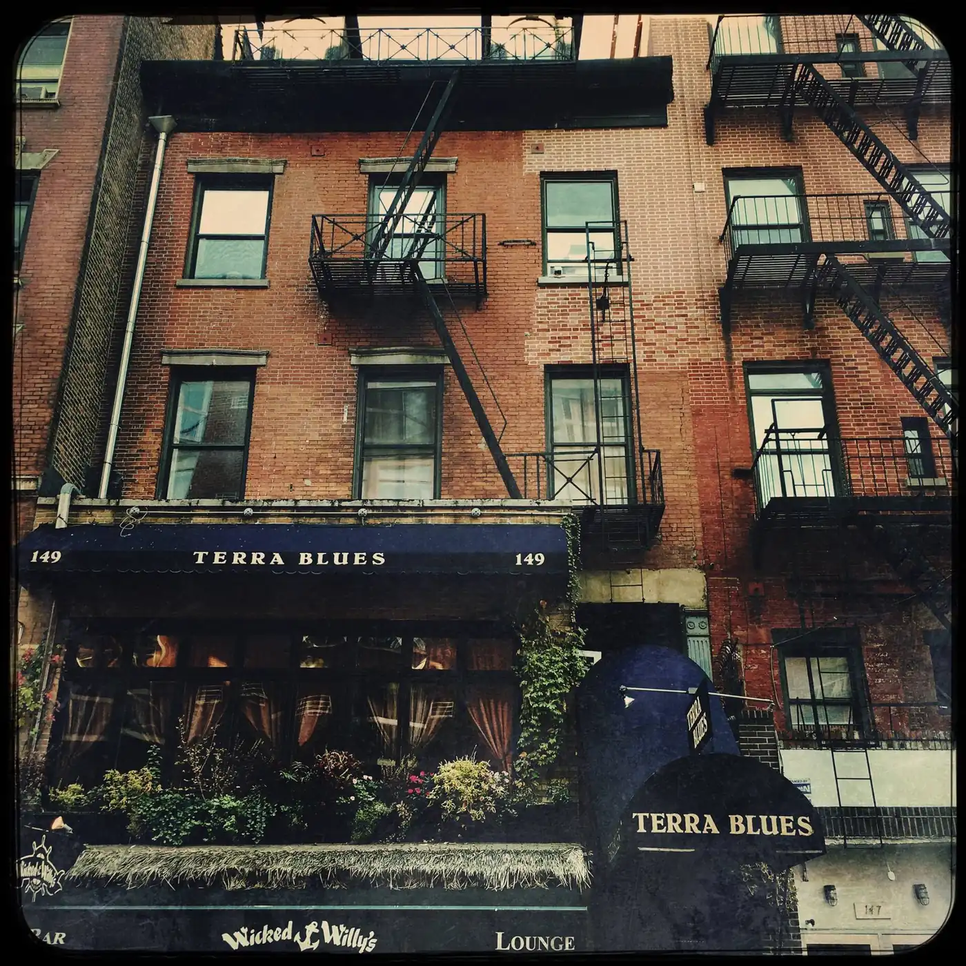 The brick front of Terra Blues on Bleecker Street