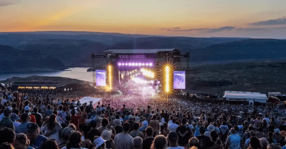A crowd in front of the main stage at the Gorge Amphitheatre at sunset