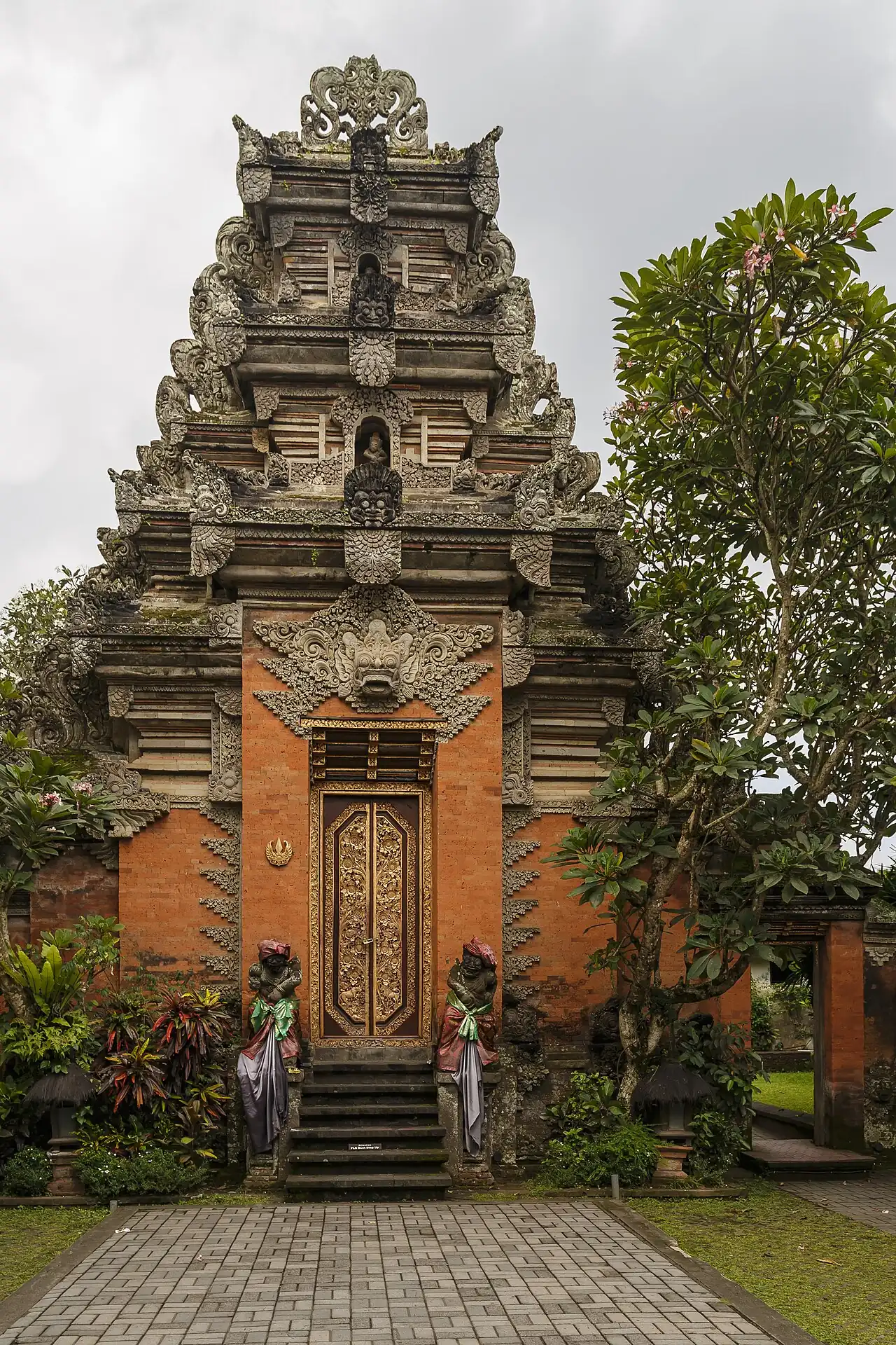A carved red-brick gateway in Ubud