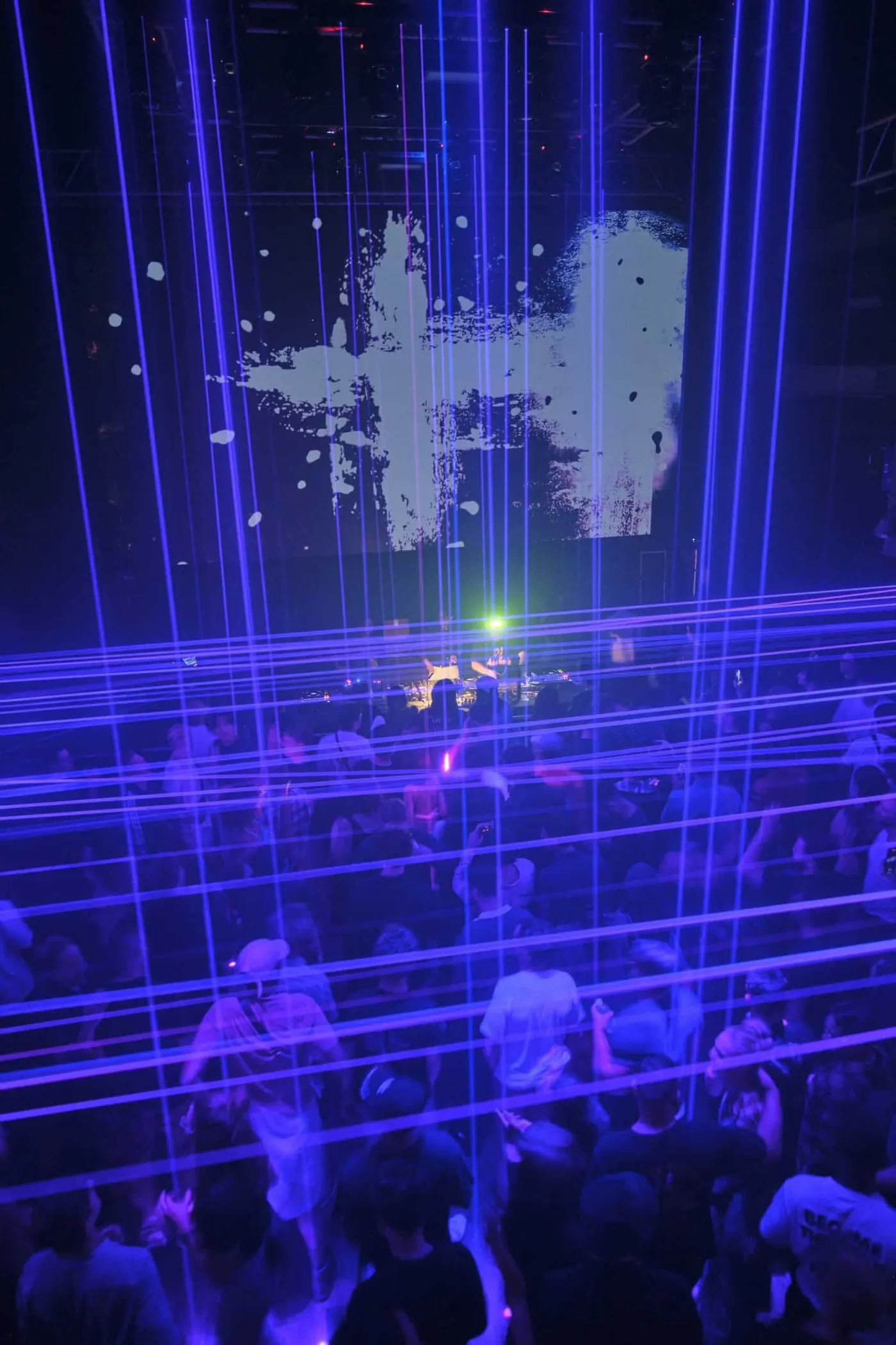 A blue-lit stage with a glowing logo