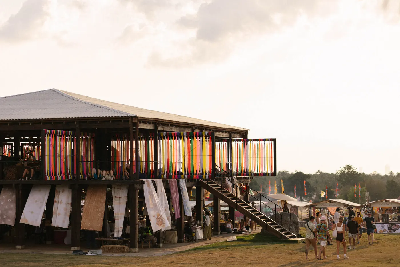 A timber pavilion with a pale canopy