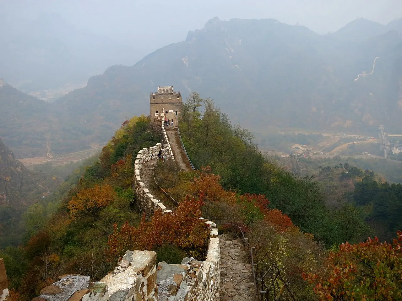 The Great Wall on a steep ridge with red foliage