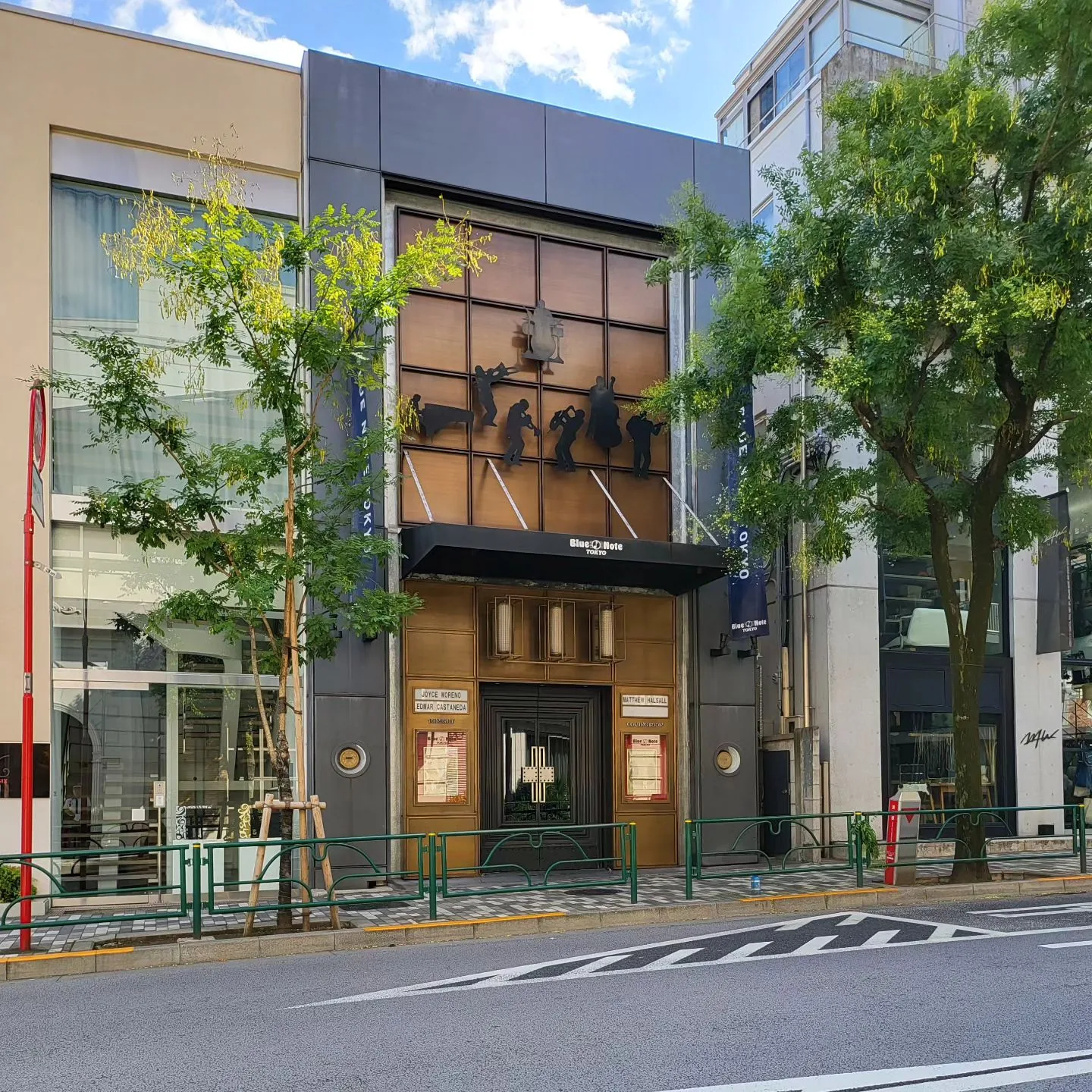 The Blue Note Tokyo street front in Minami-Aoyama, with musician silhouettes over the entrance