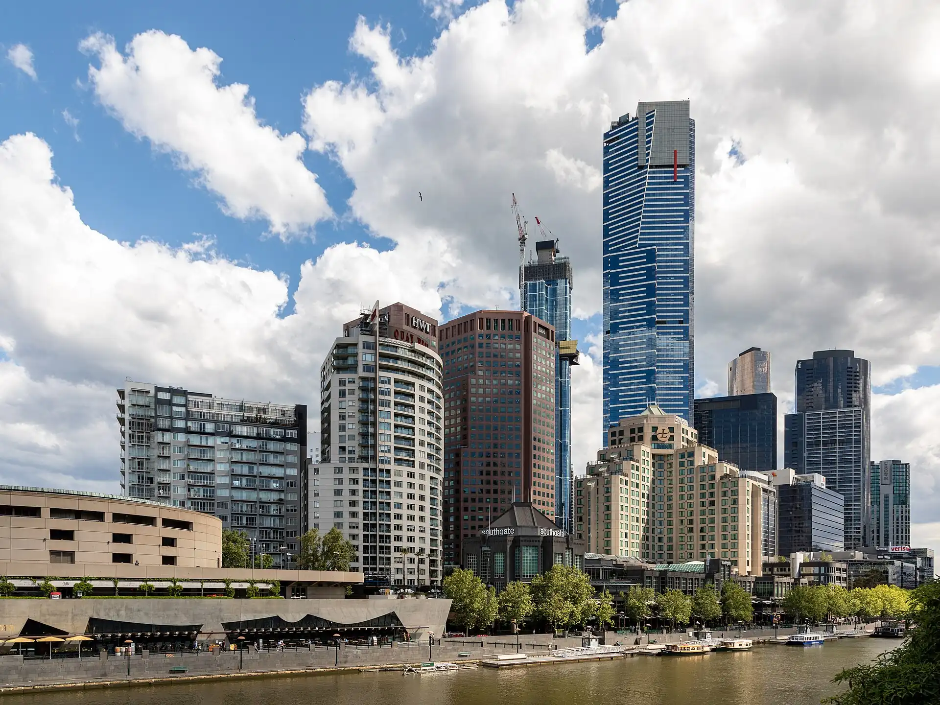 Hamer Hall on the Yarra riverbank with the Melbourne skyline behind