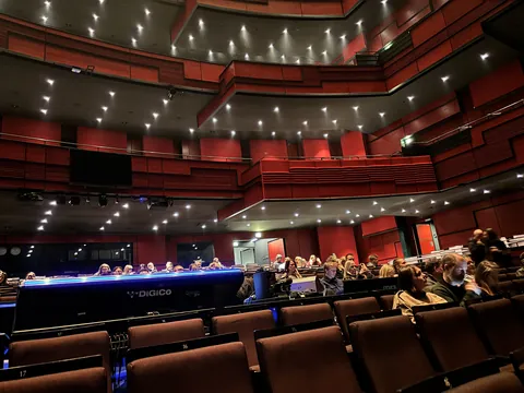 Eldborg hall at Harpa seen from the stalls, with tiers of red balconies around the stage