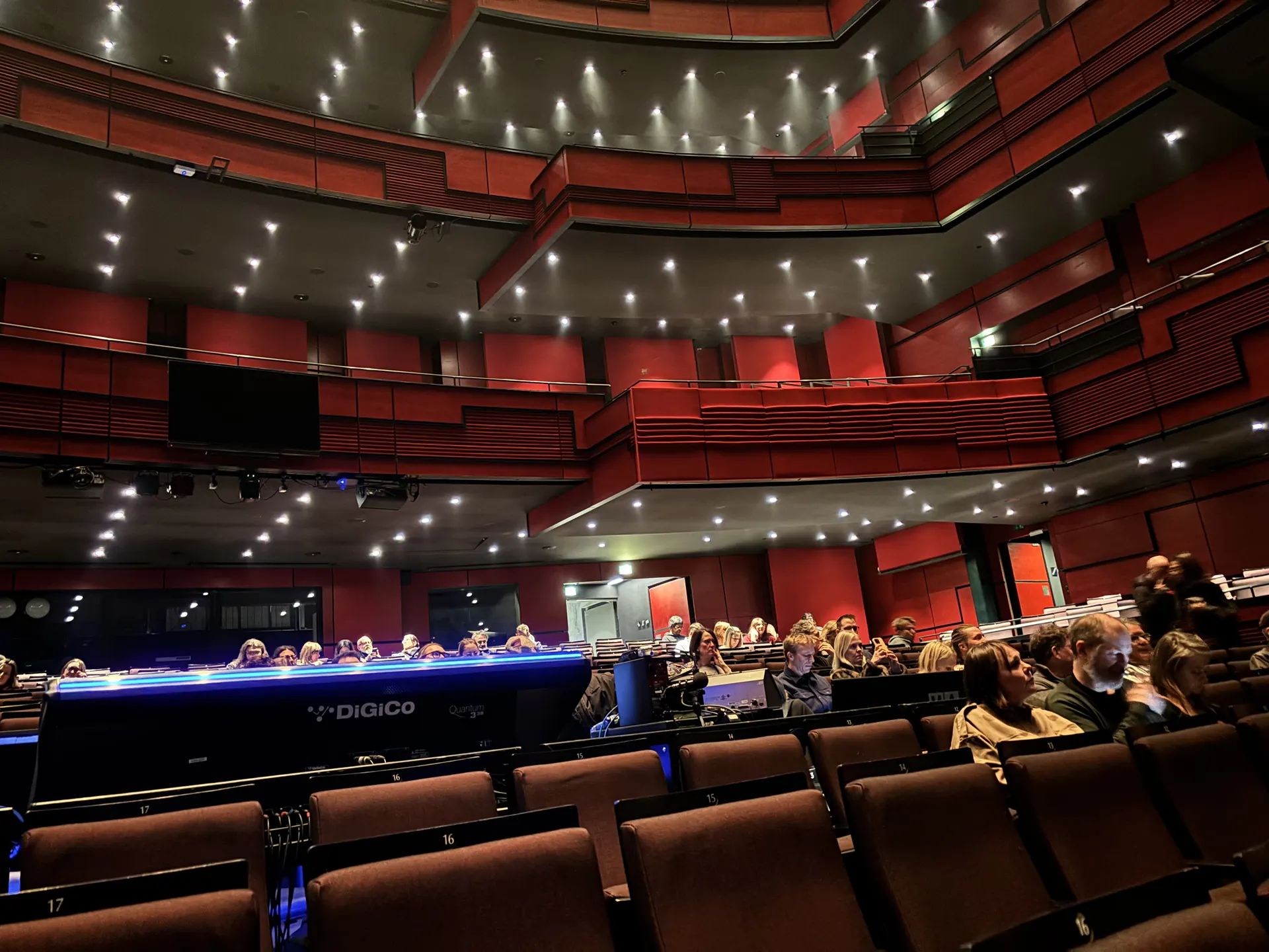 Eldborg hall at Harpa seen from the stalls, with tiers of red balconies around the stage
