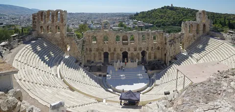The Odeon of Herodes Atticus with its stone tiers below the Acropolis