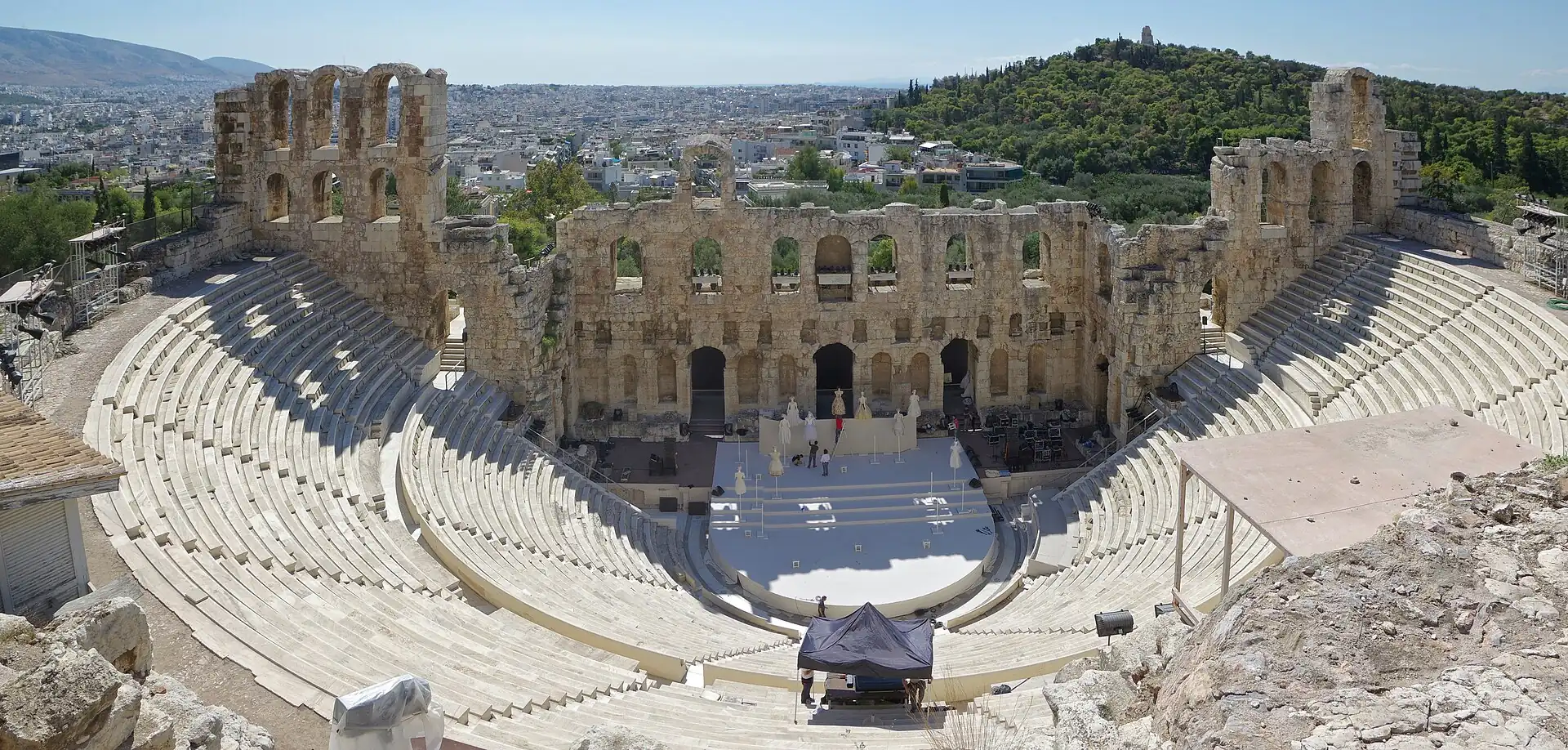 The Odeon of Herodes Atticus with its stone tiers below the Acropolis