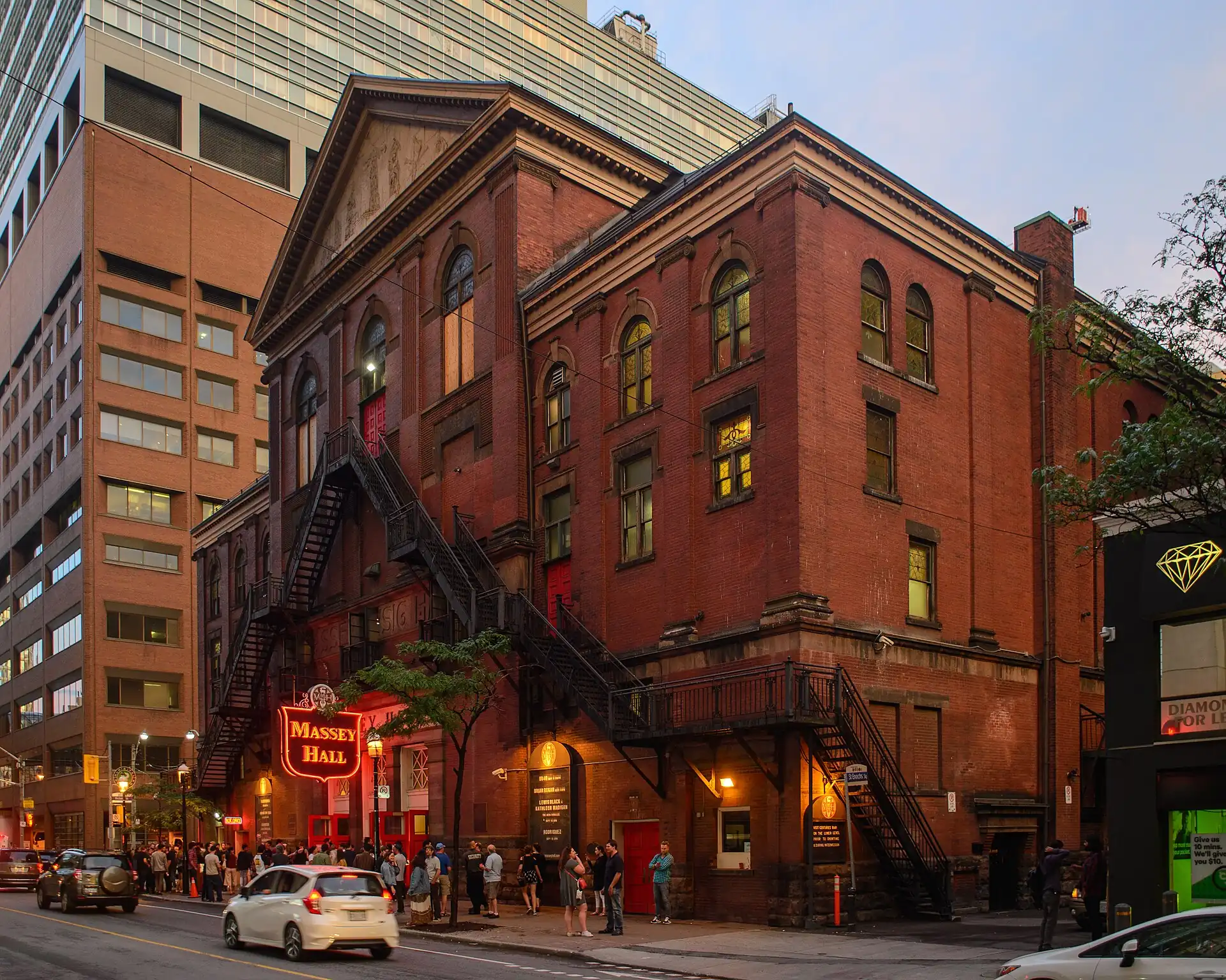 The red-brick facade of Massey Hall in Toronto in evening light