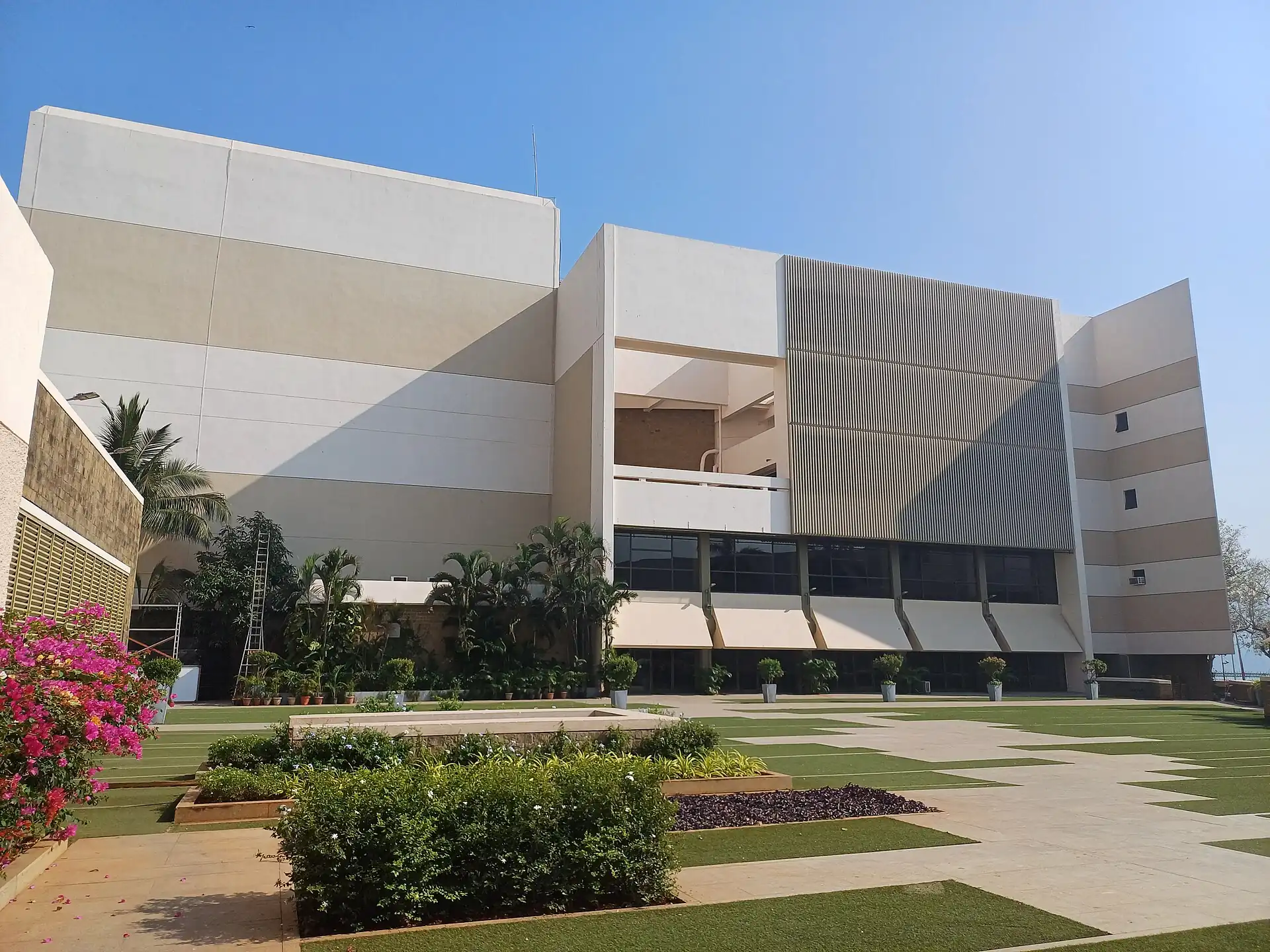 The pale, blocky exterior of the National Centre for the Performing Arts in Mumbai