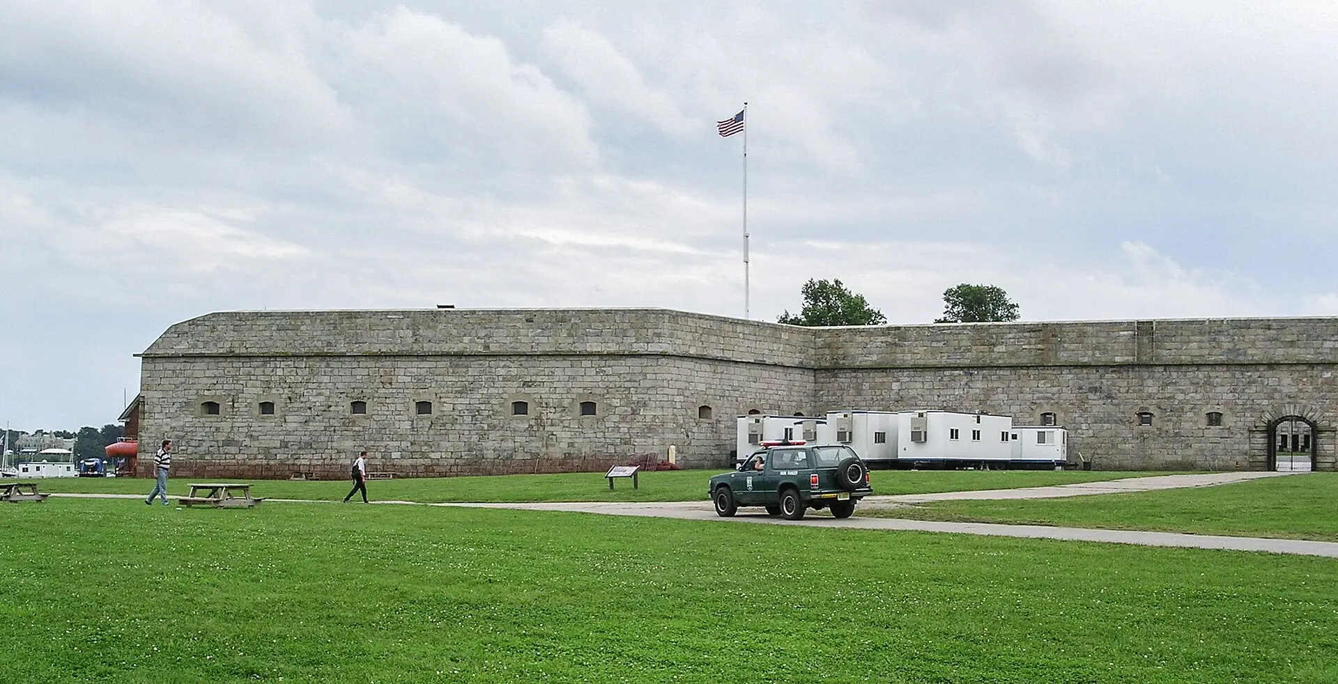 The grassy grounds and stone walls of Fort Adams in Newport