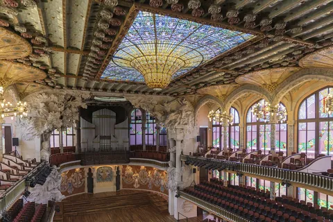 The concert hall of the Palau de la Música Catalana, with its stained-glass skylight and balconies