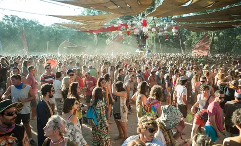 A huge crowd dancing under shade sails at Rainbow Spirit