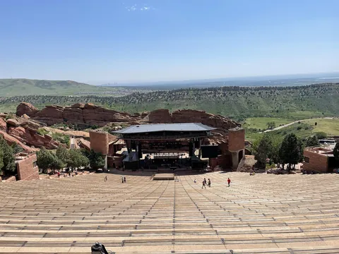 Red Rocks Amphitheatre viewed from the top, with the stage below the red sandstone walls