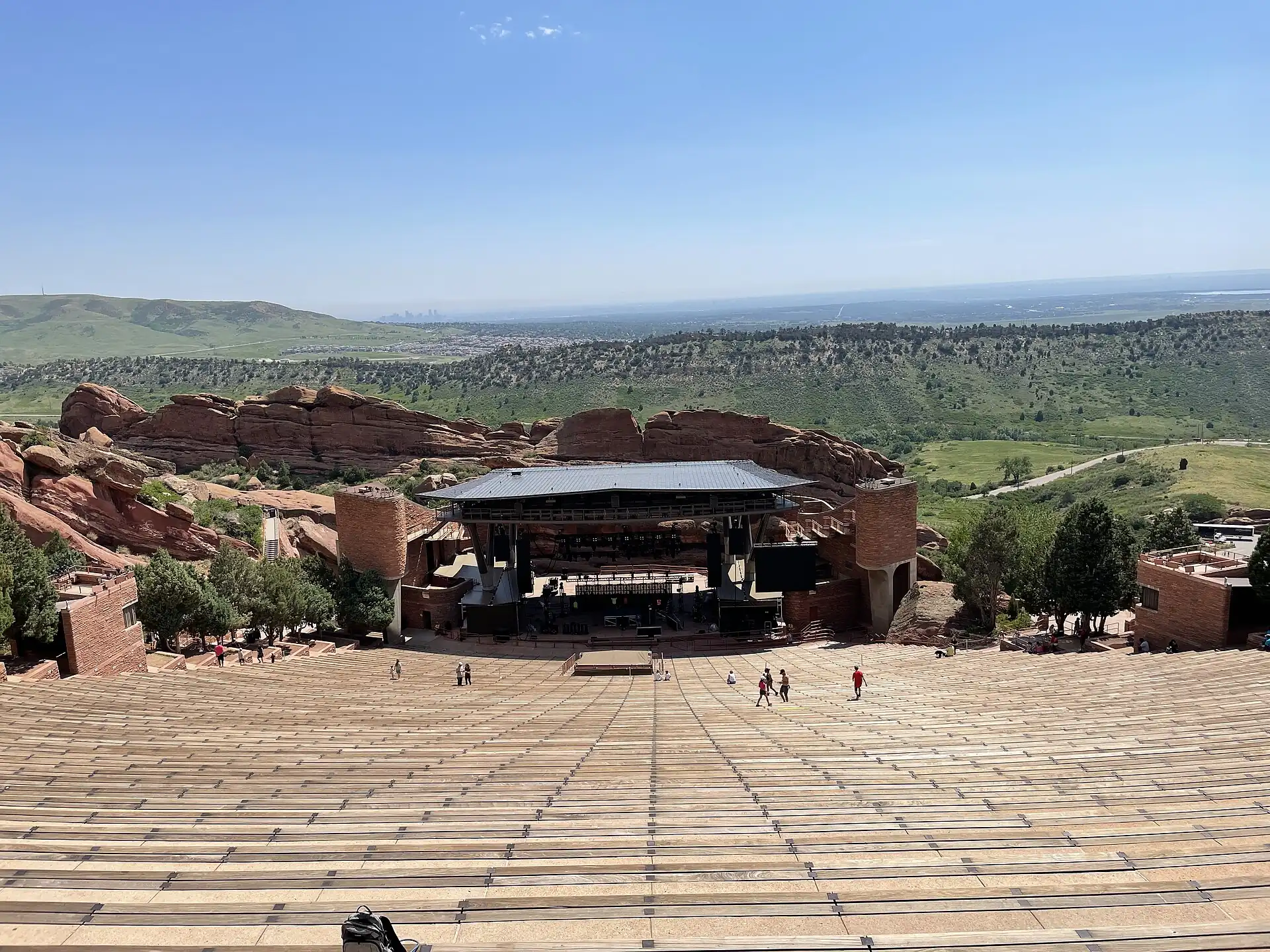 Red Rocks Amphitheatre viewed from the top, with the stage below the red sandstone walls