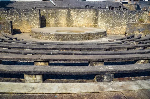 The empty stone tiers and round stage of the Old Fort amphitheatre in Stone Town