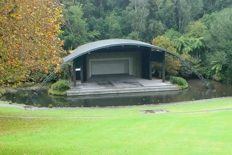 The curved-roof stage of the Bowl of Brooklands set in green parkland