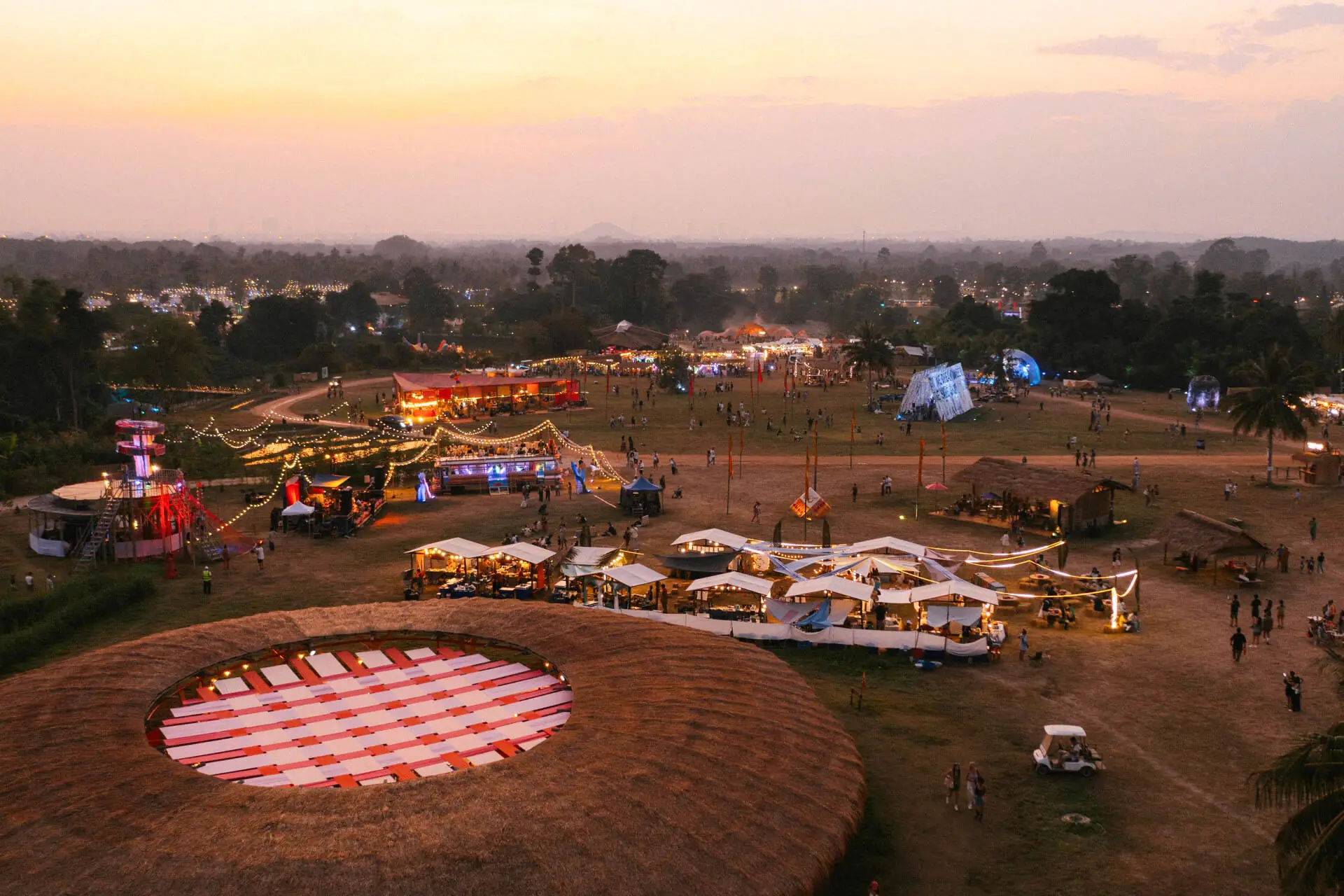 An aerial view of the Wonderfruit site with a circular pink dance floor